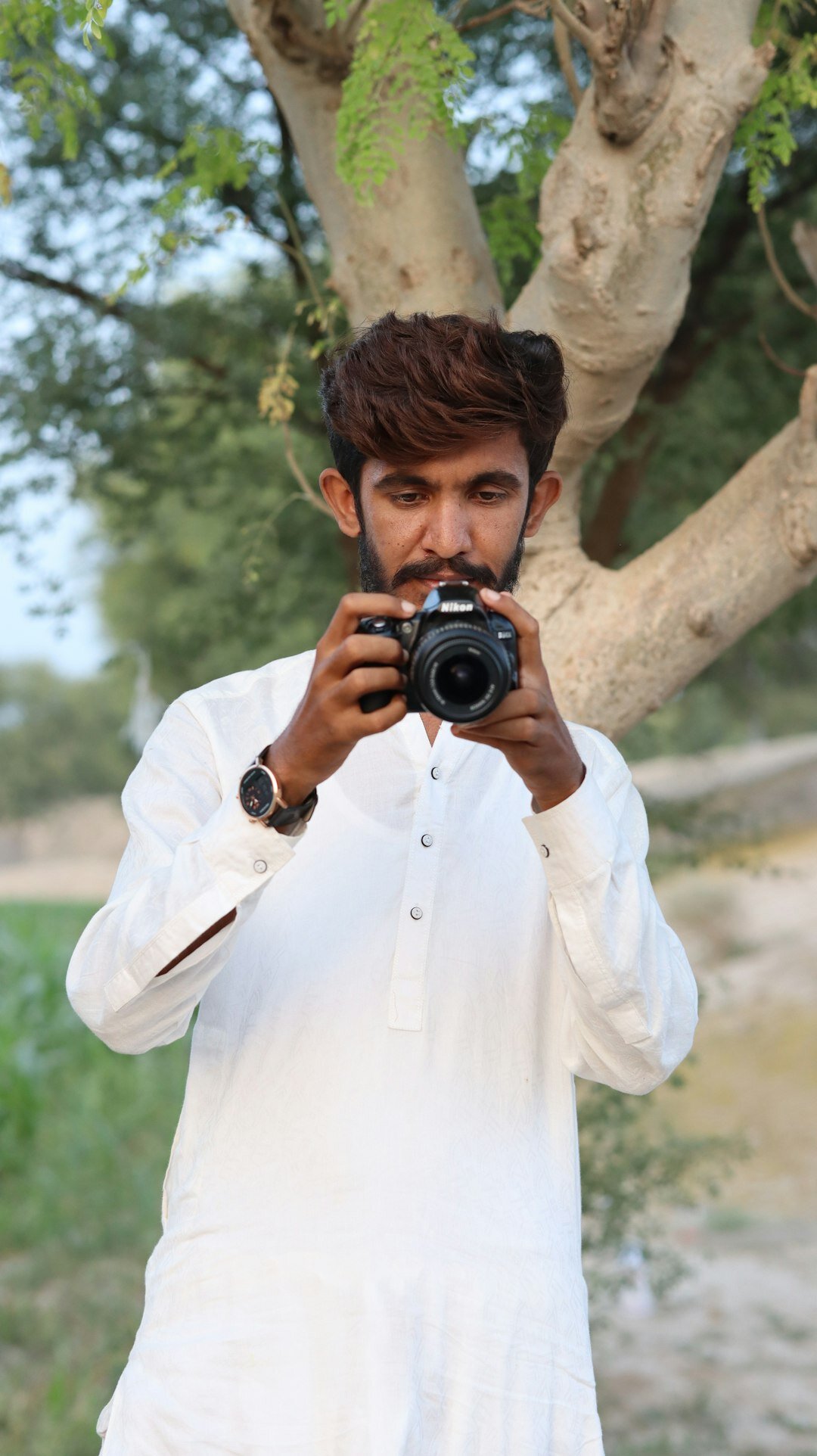 Portrait of a Danish photographer holding a camera