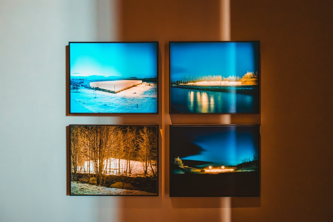 Framed photographic prints displayed on a gallery wall